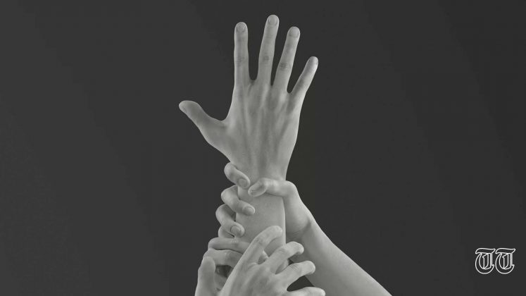 A file photo is shown of a hand reaching for help.