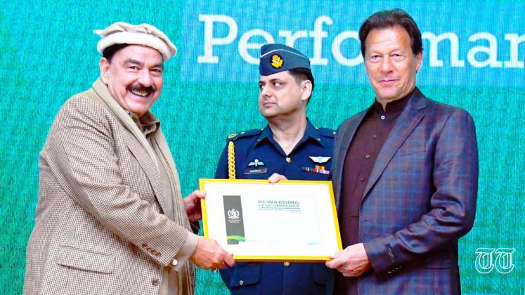 A file photo is shown of PTI chairman Imran Khan with former Railways Minister Sheikh Rashid.