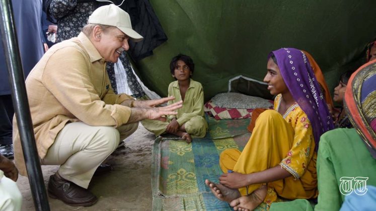 A file photo is shown of prime minister Shahbaz Sharif at a flood victim camp.