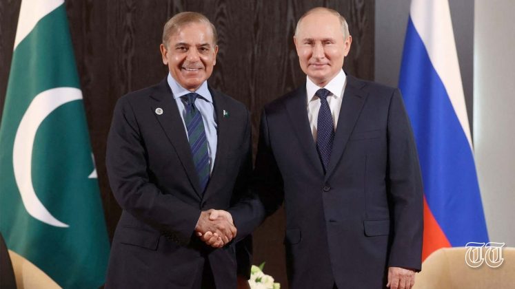 A file photo is shown of PM Shehbaz Sharif with Russian President Vladimir Putin.