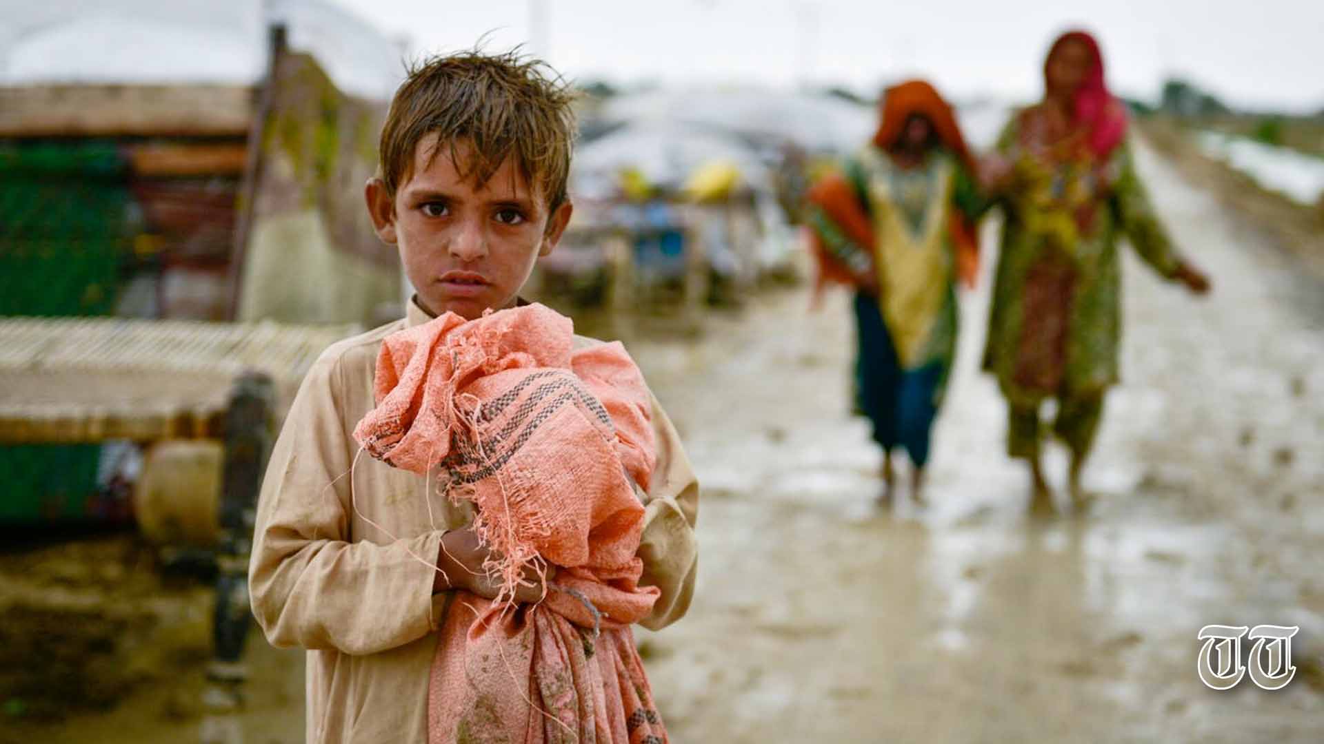 A file photo is shown of a Pakistani child amidst the aftermath of the 2022 floods.