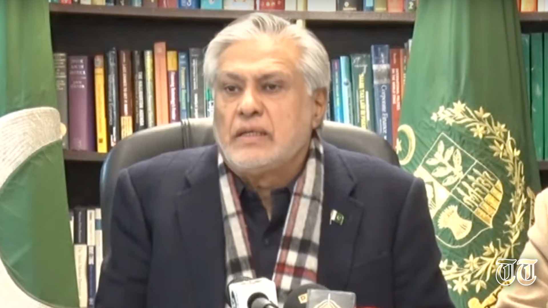 A file photo is shown of foreign minister Ishaq Dar speaking to the press.