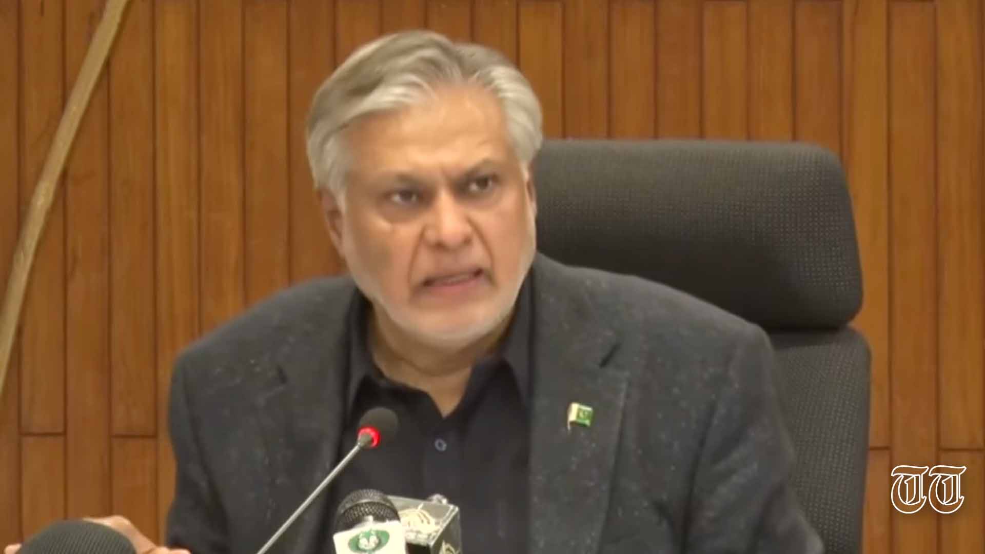 A file photo is shown of finance minister Ishaq Dar addressing a press conference.