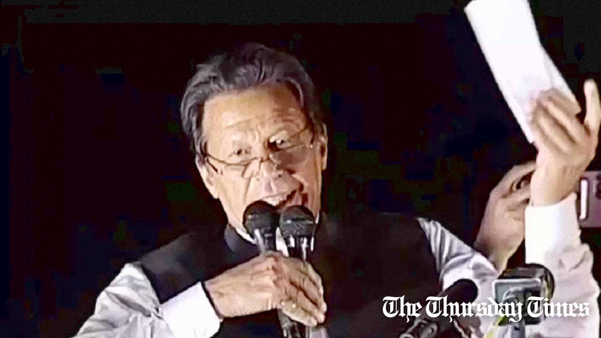 A file photo is shown of PTI chairman Imran Khan presenting a 'cipher' in 2022. — FILE/THE THURSDAY TIMES