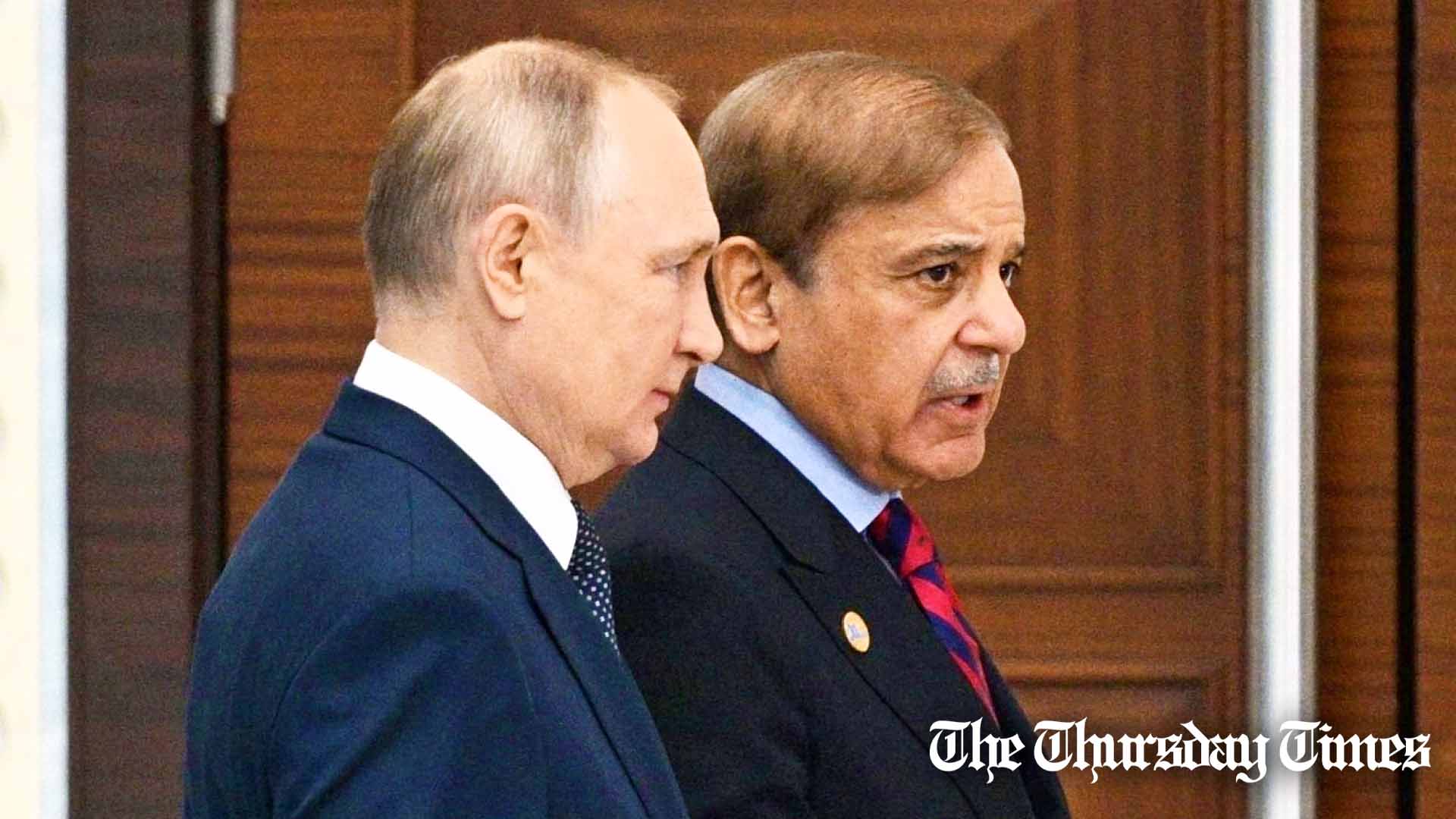 A file photo is shown of Russian premier Vladimir Putin (L) and Pakistani prime minister Shehbaz Sharif (R) at Astana in October 2022. — FILE/KREMLIN