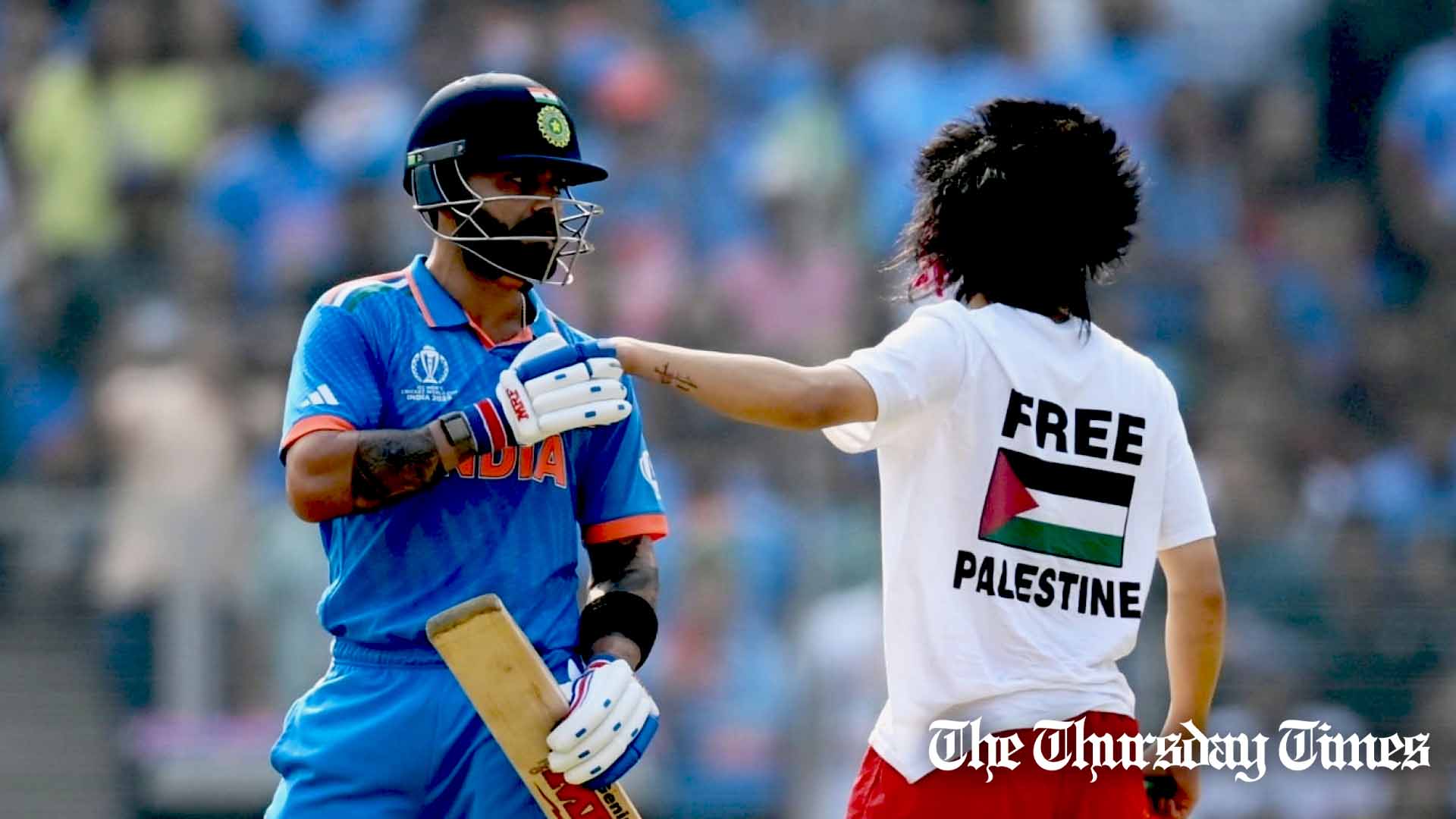 A protestor makes their way towards Virat Kohli during the Men's Cricket World Cup India 2023 Final between India and Australia at Narendra Modi Stadium in Ahmedabad on November 19, 2023. — GARETH COPLEY