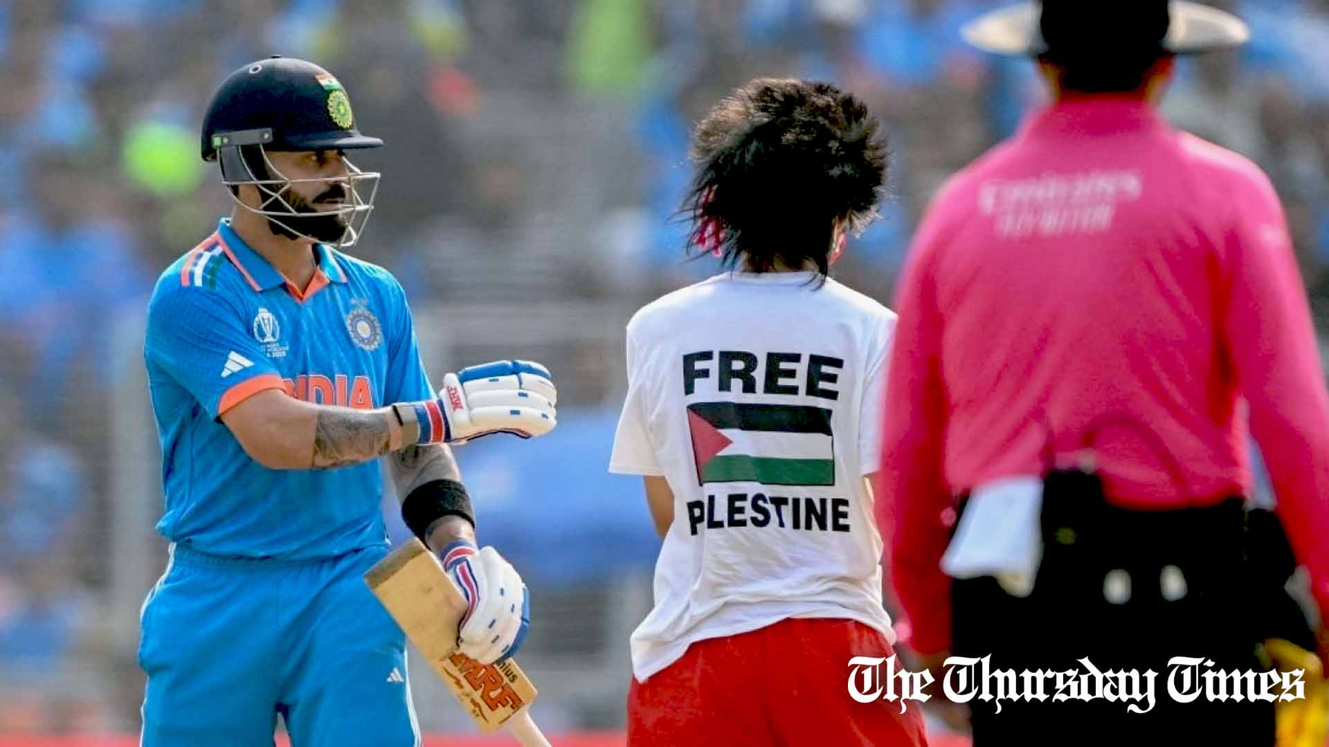 A protestor makes their way towards Virat Kohli during the Men's Cricket World Cup India 2023 Final between India and Australia at Narendra Modi Stadium in Ahmedabad on November 19, 2023. — AFP