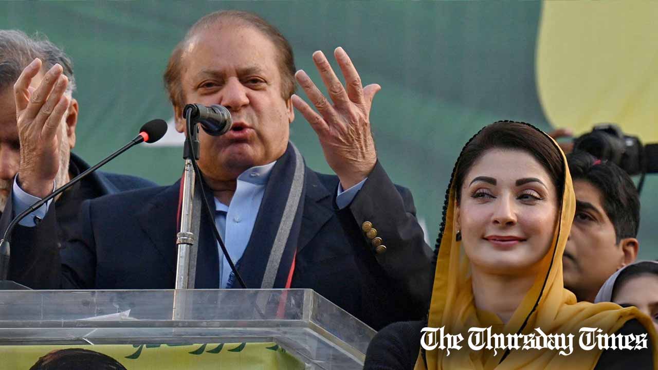 Maryam Nawaz stands next to her father, former prime minister Nawaz Sharif, at Lahore on January 29, 2024. — AFP