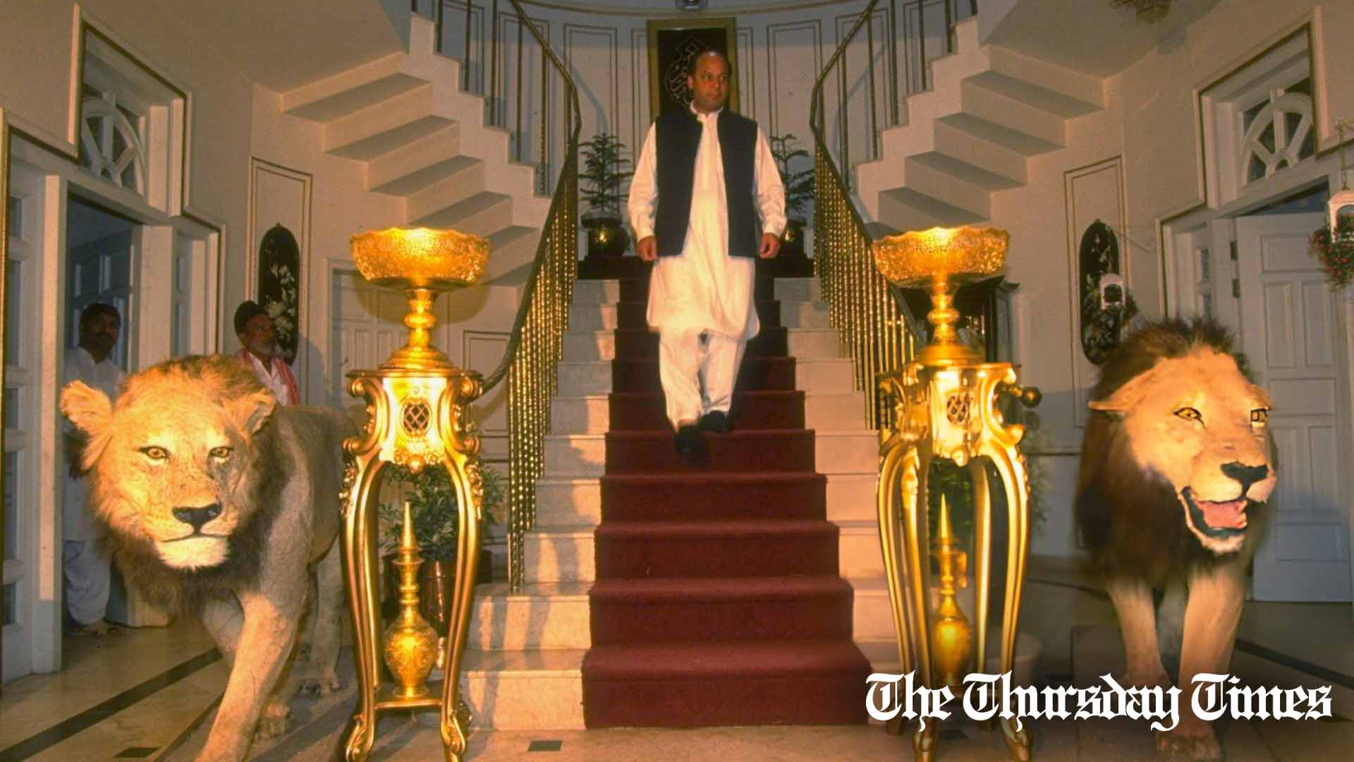 A file photo is shown of then-PM candidate Nawaz Sharif descending a flight of stairs encompassed by lions, the PML(N)'s novel party symbol. — FILE