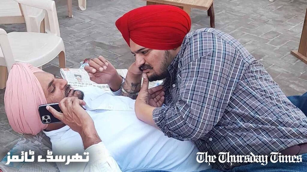 A file photo is shown of Sidhu Moosewala with his father Sardar Balkaur Singh on July 13, 2022. — FILE/THE THURSDAY TIMES